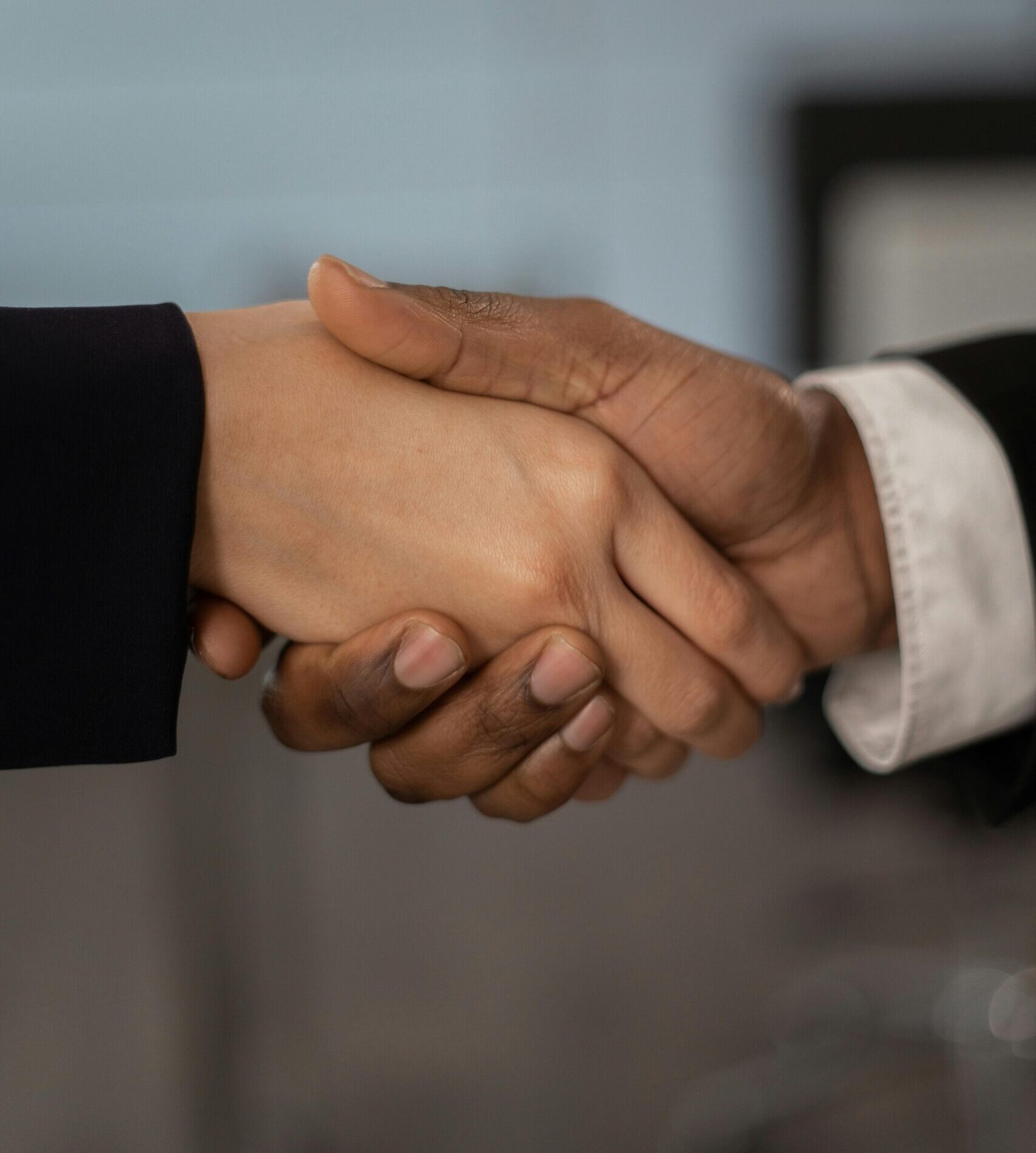 Close-up of a professional handshake symbolizing business partnership and agreement.